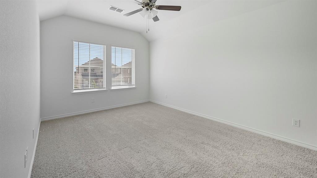 3421 Amaretto Road Aubrey, TX 76227 - Photo 14 of 38 an empty room with a window