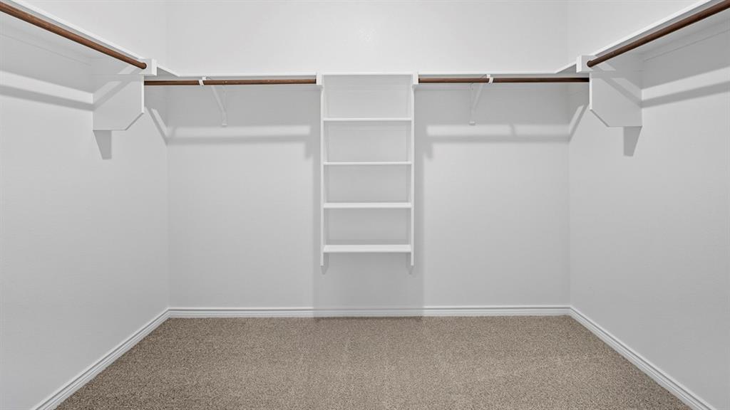 3421 Amaretto Road Aubrey, TX 76227 - Photo 19 of 38 a view of an empty walk in closet