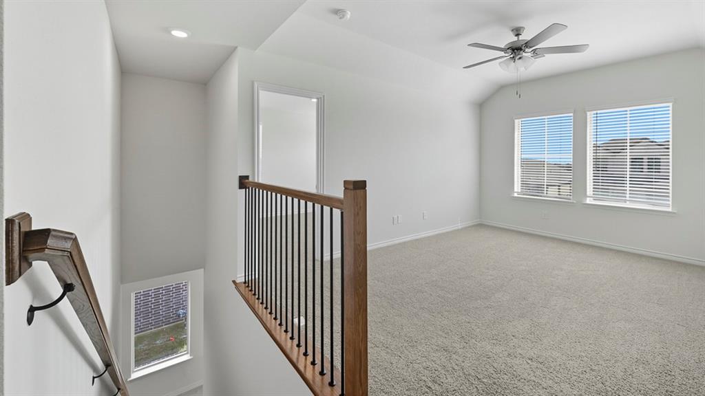 3421 Amaretto Road Aubrey, TX 76227 - Photo 22 of 38 a view of an empty room with a window