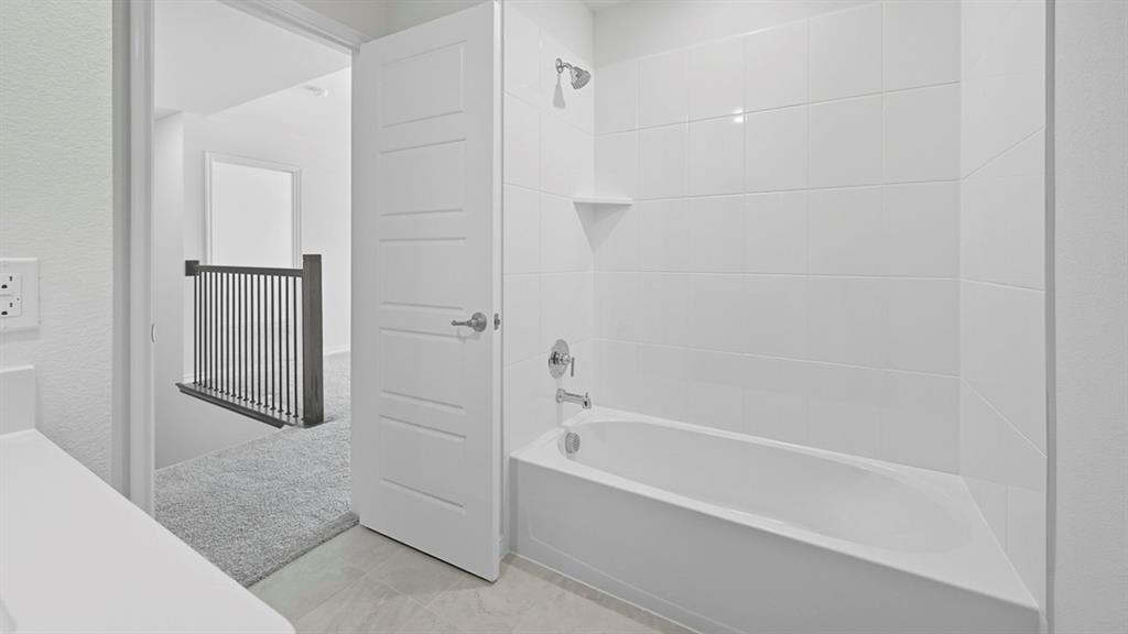 3421 Amaretto Road Aubrey, TX 76227 - Photo 6 of 38 a bathroom with a bathtub