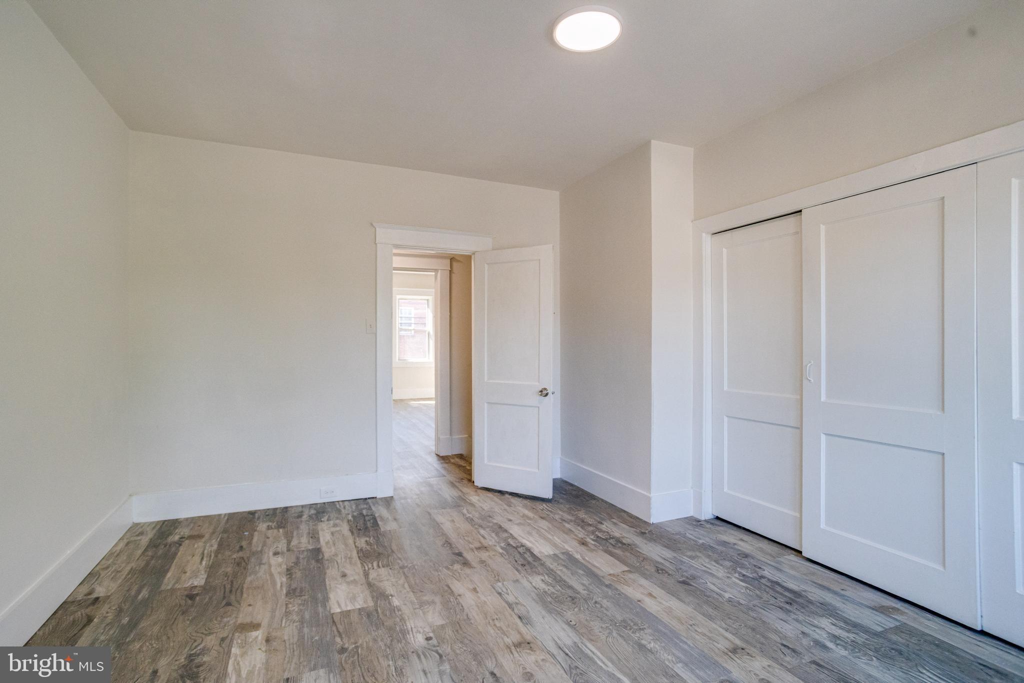 5878 Belair Road Baltimore, MD 21206 - Photo 19 of 41 a view of an empty room and wooden floor