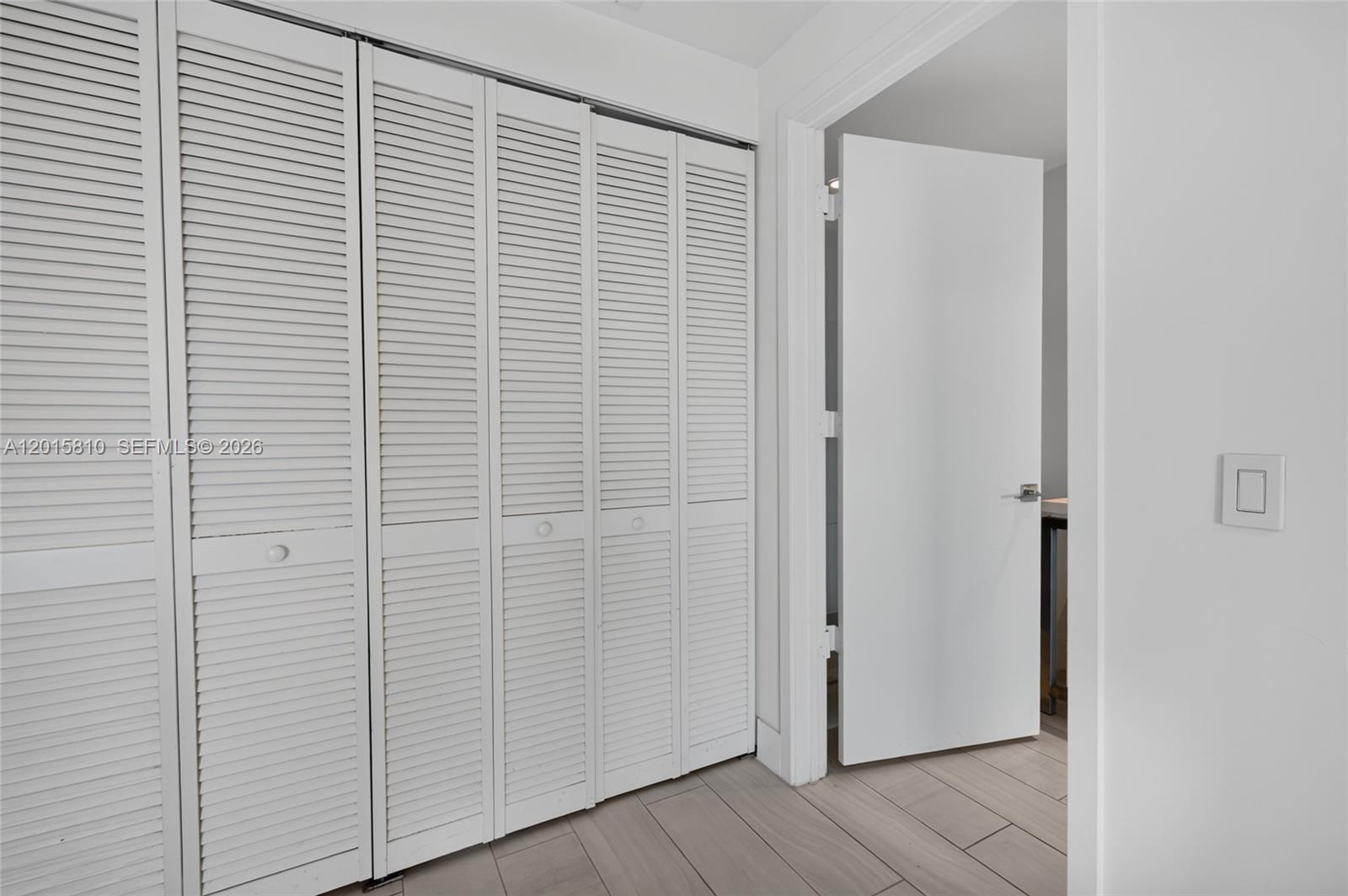 2000 Metropica Way, Unit 1902 Sunrise, FL 33323 - Photo 16 of 40 a view of small space with wooden floor