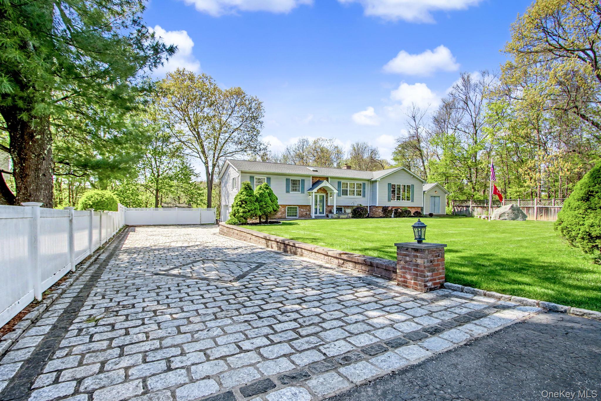 24 Richard Road Mahopac, NY 10541 - Photo 1 of 47 a view of a yard with plants and a fountain