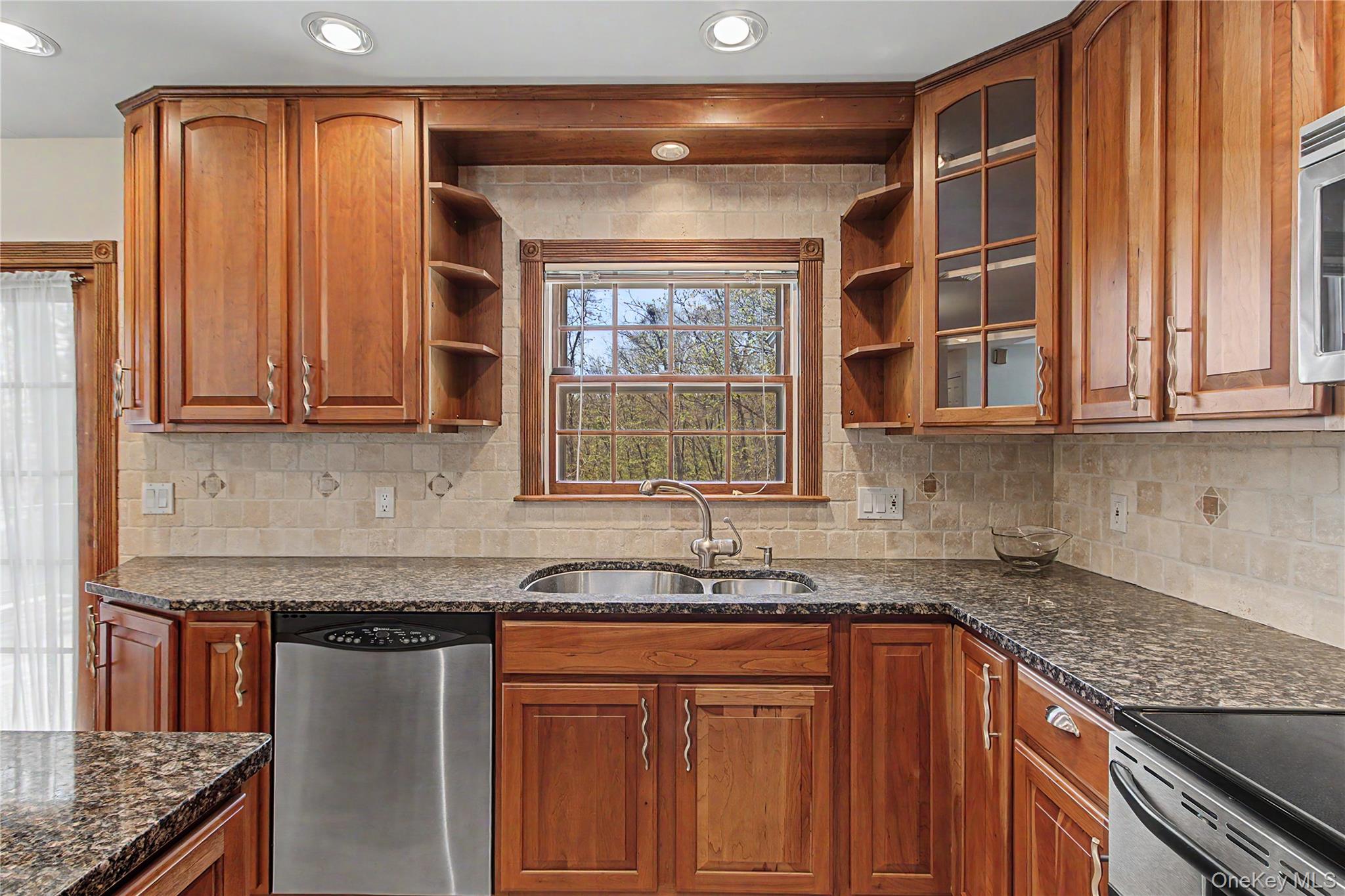 24 Richard Road Mahopac, NY 10541 - Photo 14 of 47 a kitchen with stainless steel appliances granite countertop a sink and a counter space