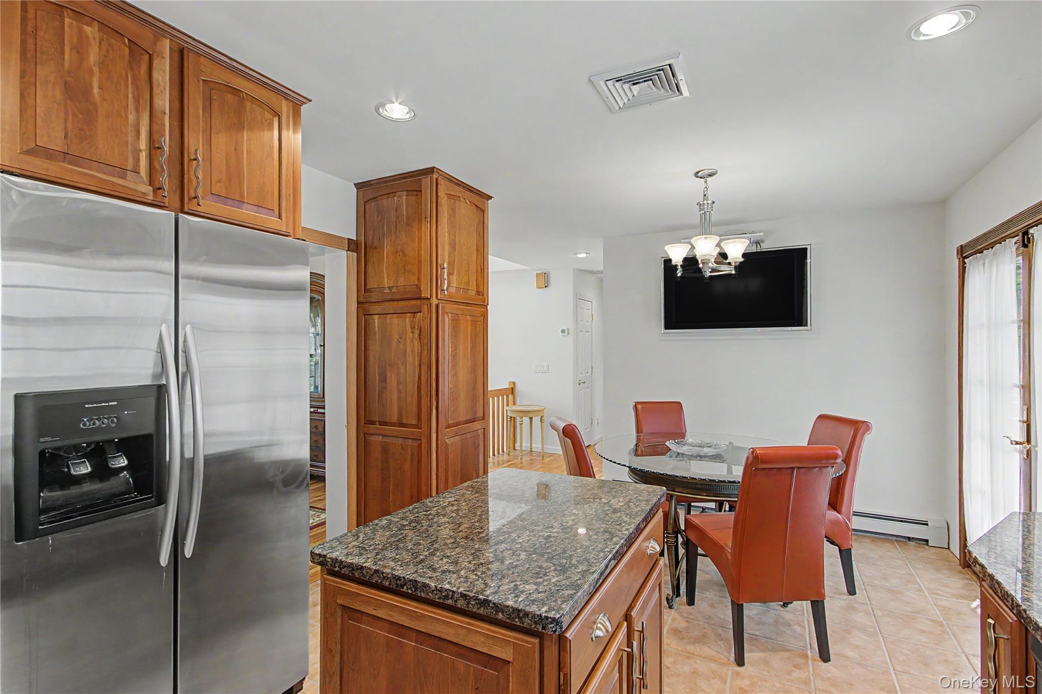 24 Richard Road Mahopac, NY 10541 - Photo 15 of 47 a kitchen with stainless steel appliances granite countertop a refrigerator a stove and a sink with wooden floor