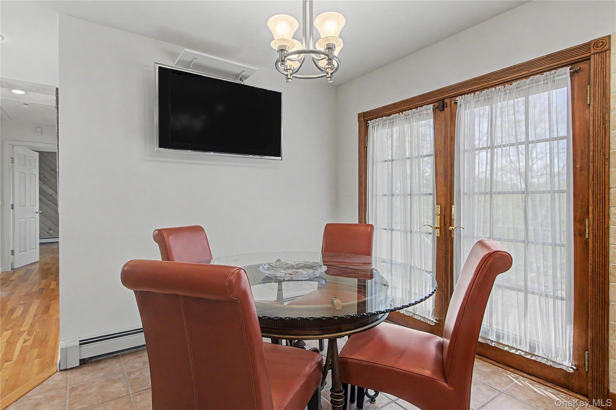 24 Richard Road Mahopac, NY 10541 - Photo 17 of 47 a view of a dining room with furniture window and wooden floor