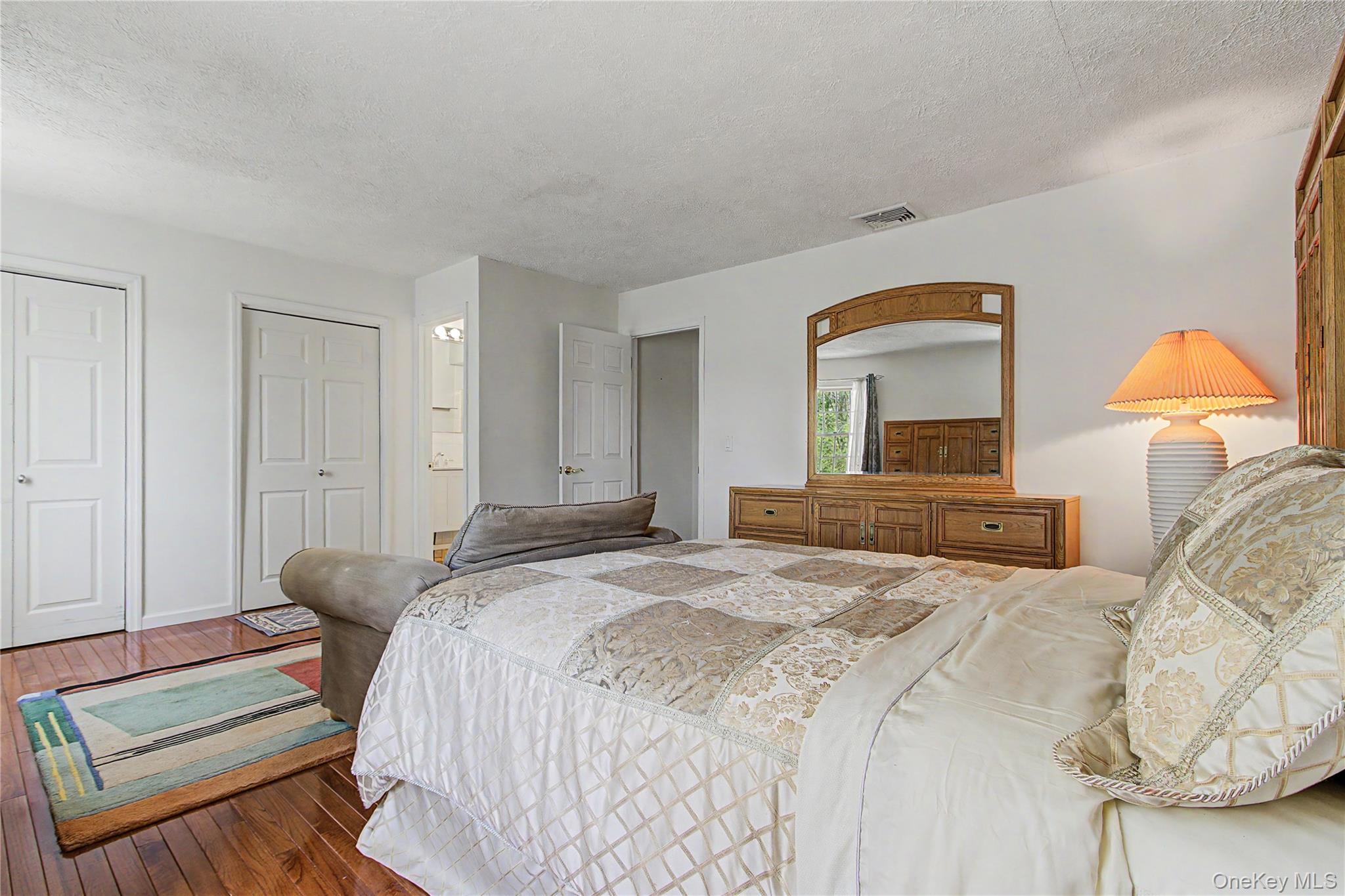 24 Richard Road Mahopac, NY 10541 - Photo 20 of 47 a bedroom with a bed and a mirror