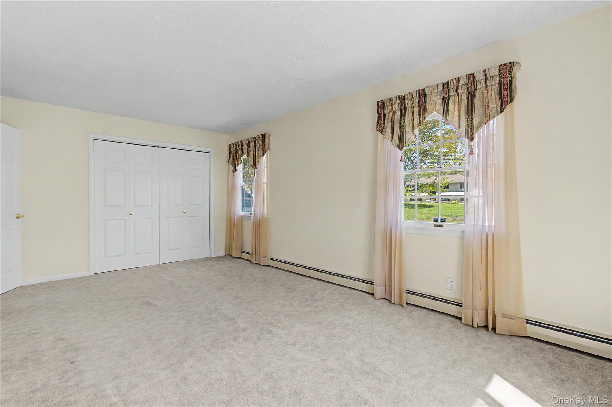 24 Richard Road Mahopac, NY 10541 - Photo 24 of 47 an empty room with windows and closet