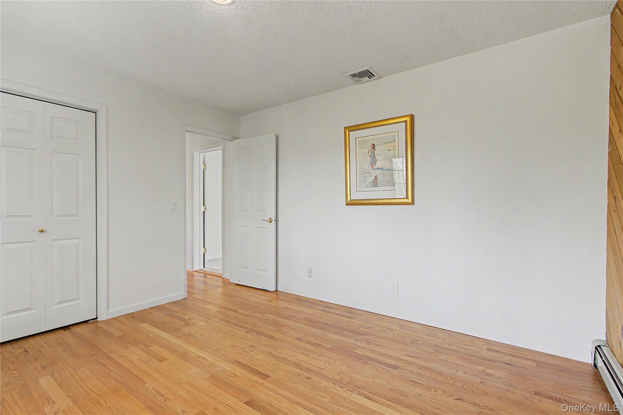 24 Richard Road Mahopac, NY 10541 - Photo 27 of 47 a view of an empty room with wooden floor
