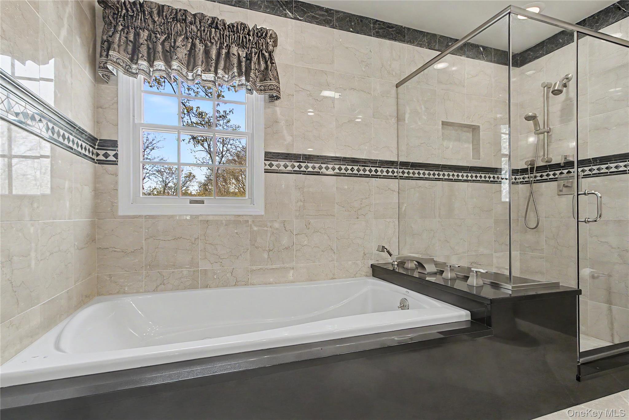 24 Richard Road Mahopac, NY 10541 - Photo 29 of 47 a bathroom with a bathtub and a shower