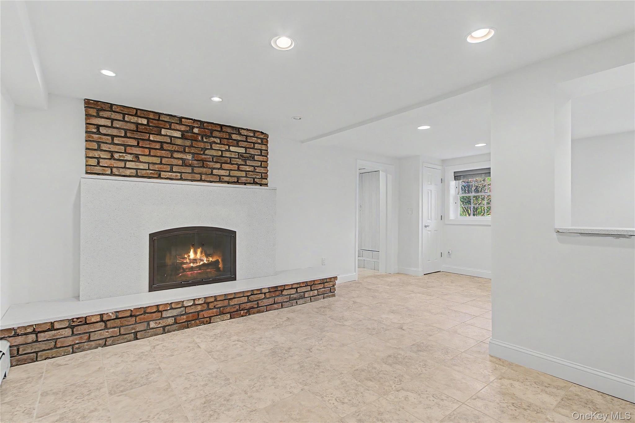 24 Richard Road Mahopac, NY 10541 - Photo 31 of 47 a view of an empty room with a fireplace and a window