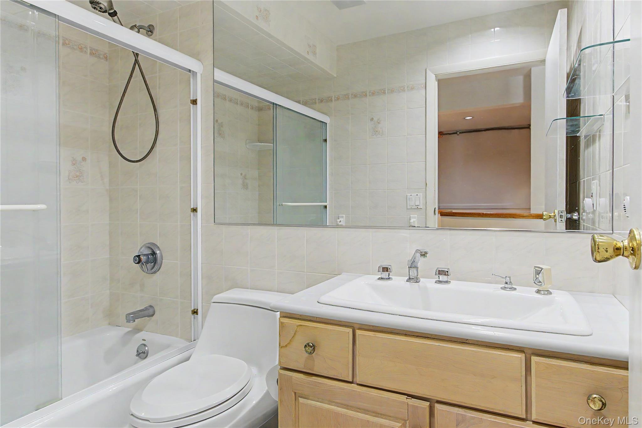 24 Richard Road Mahopac, NY 10541 - Photo 35 of 47 a bathroom with a sink a toilet and shower
