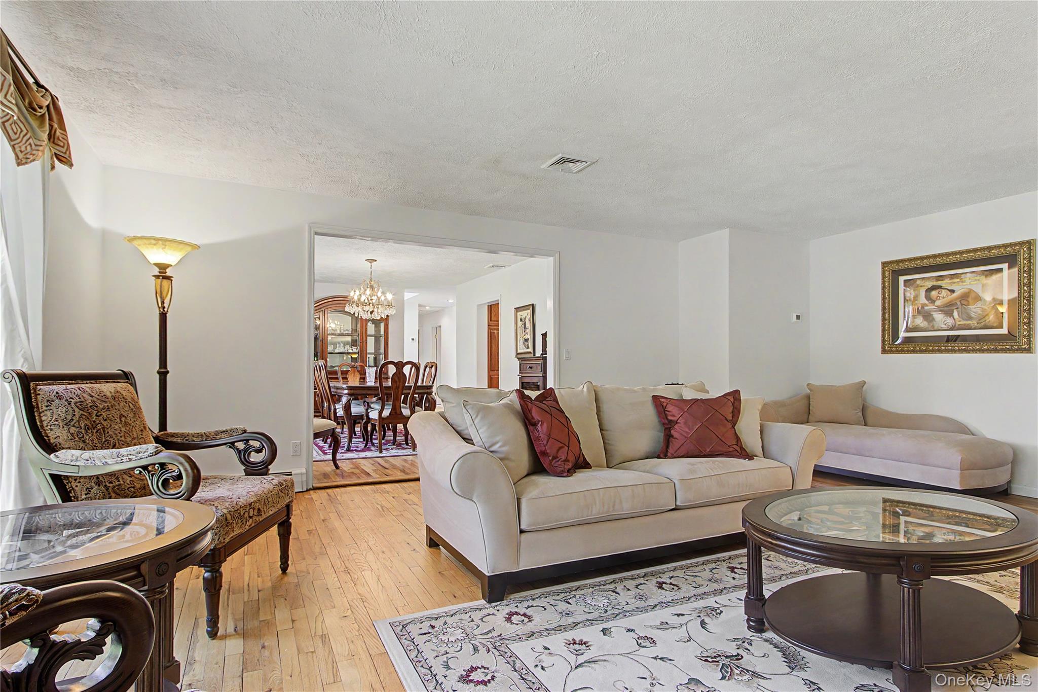 24 Richard Road Mahopac, NY 10541 - Photo 4 of 47 a living room with furniture a rug a lamp and a window