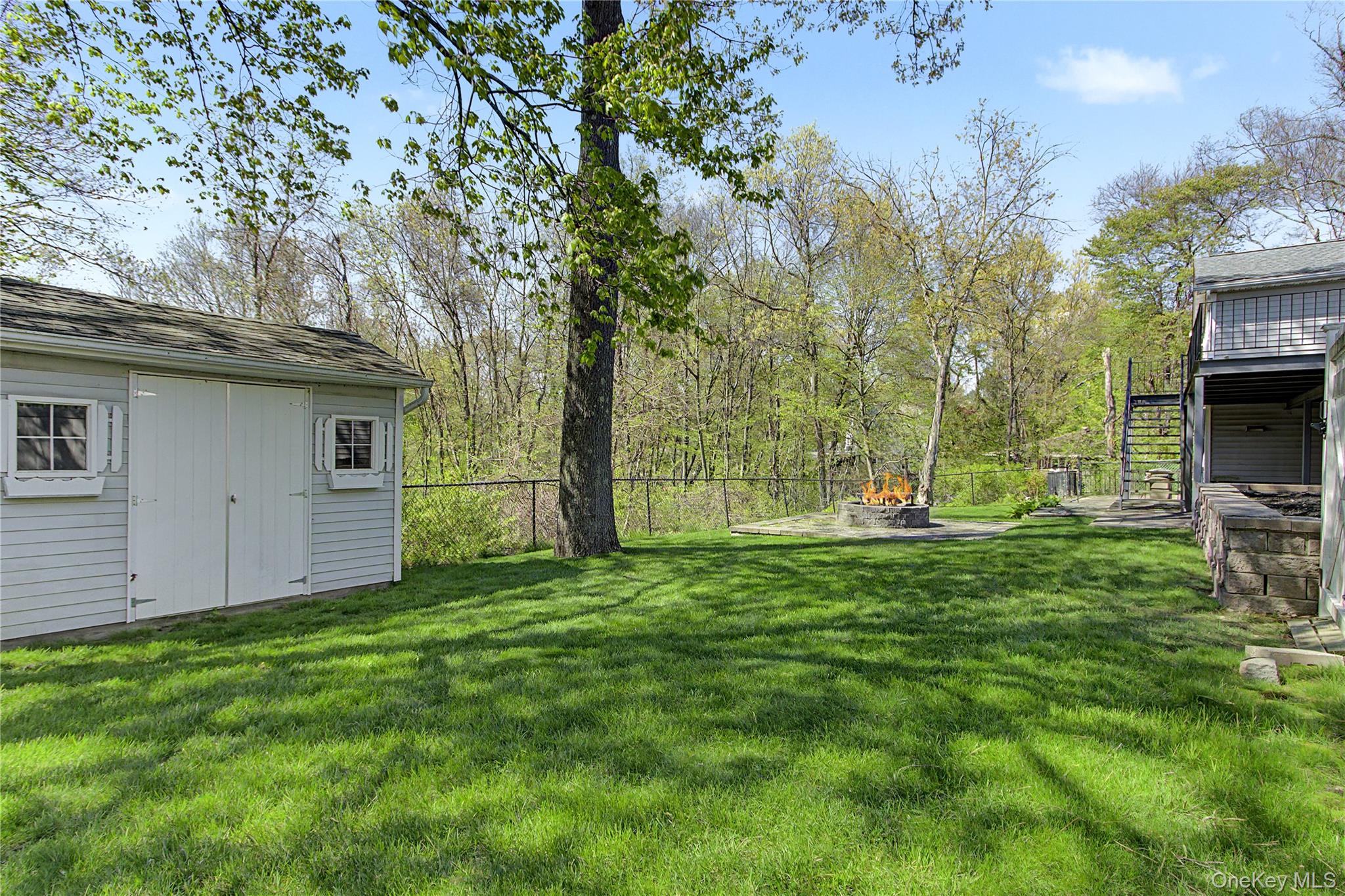 24 Richard Road Mahopac, NY 10541 - Photo 42 of 47 a view of a backyard with a large tree