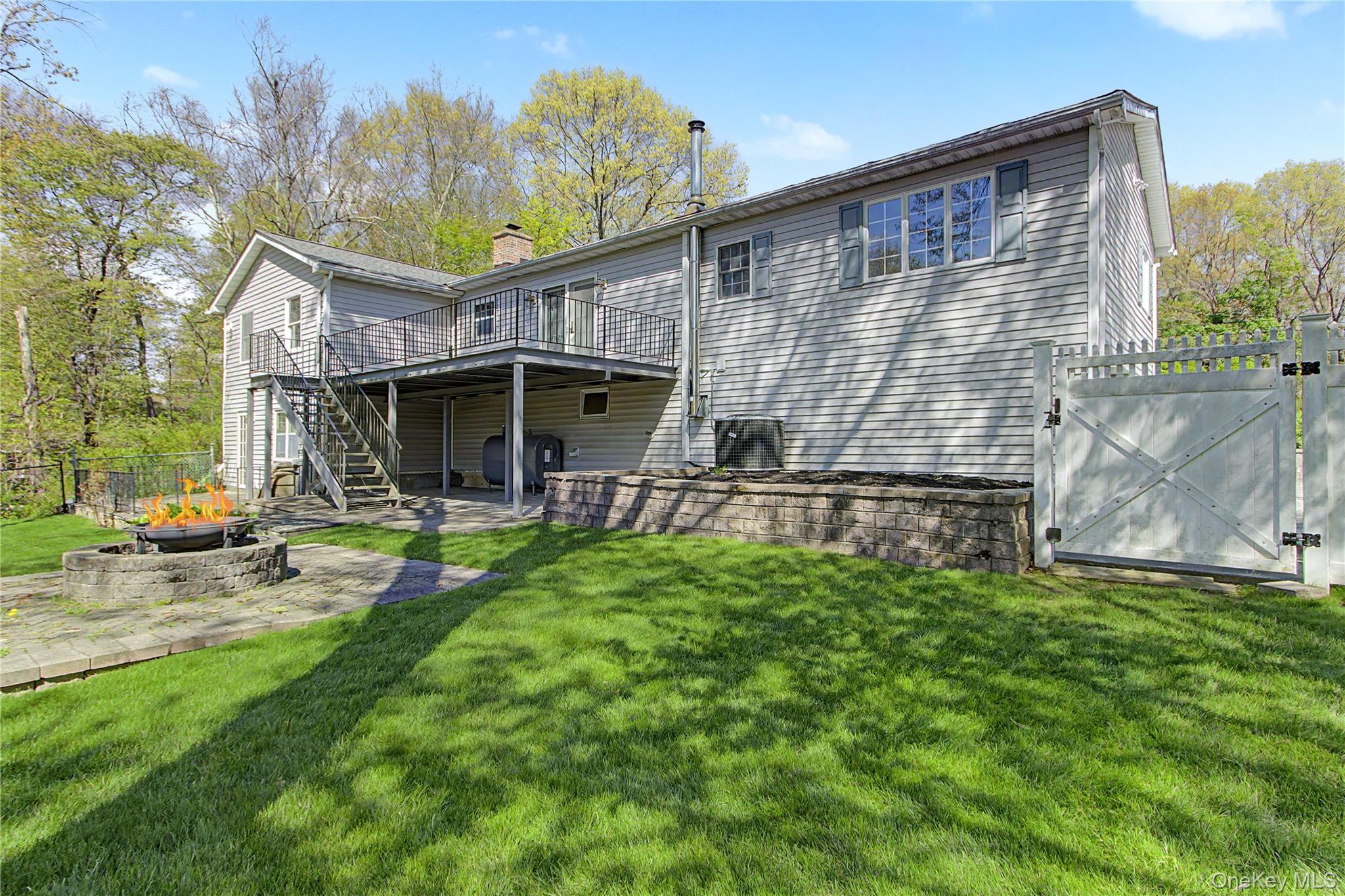 24 Richard Road Mahopac, NY 10541 - Photo 43 of 47 a view of a house with backyard porch and sitting area