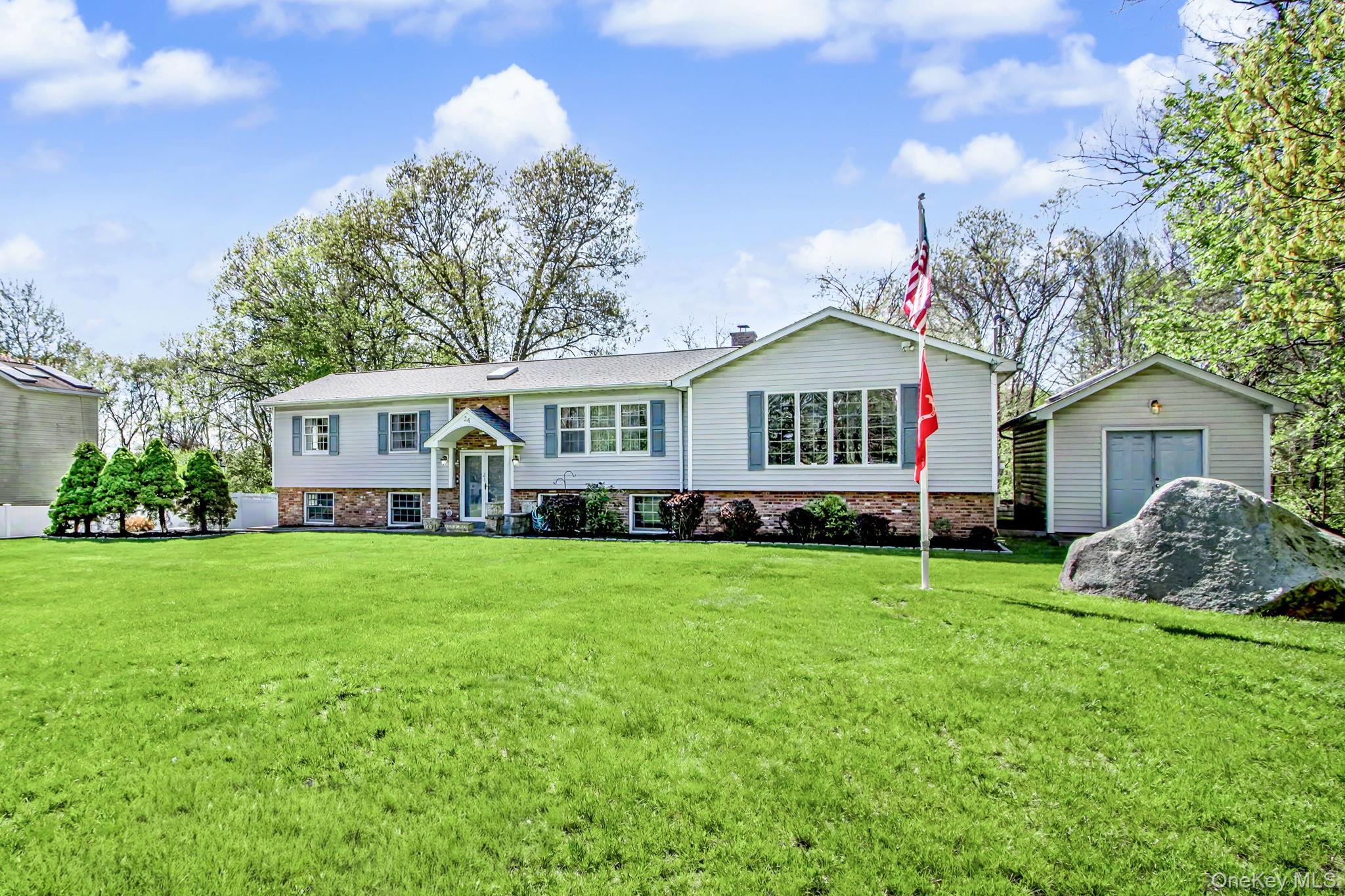 24 Richard Road Mahopac, NY 10541 - Photo 45 of 47 a front view of a house with garden