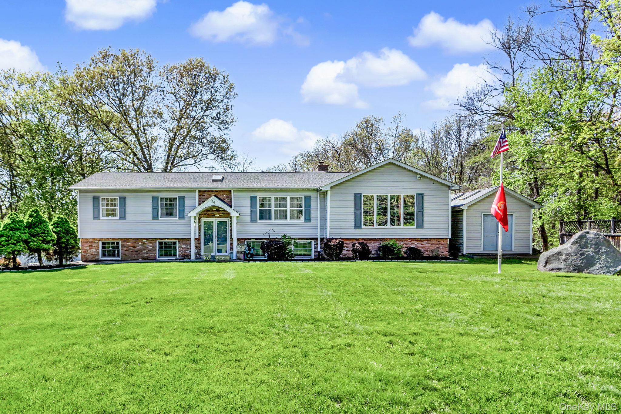 24 Richard Road Mahopac, NY 10541 - Photo 47 of 47 a view of a house with a big yard and large trees
