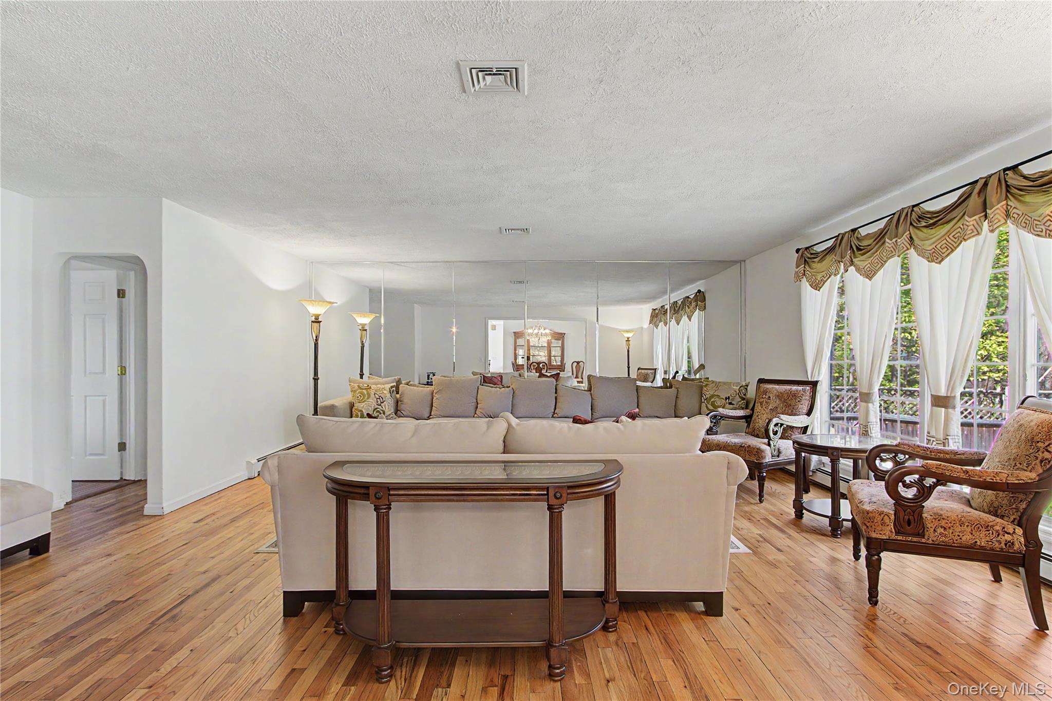 24 Richard Road Mahopac, NY 10541 - Photo 7 of 47 a living room with fireplace furniture and a wooden floor