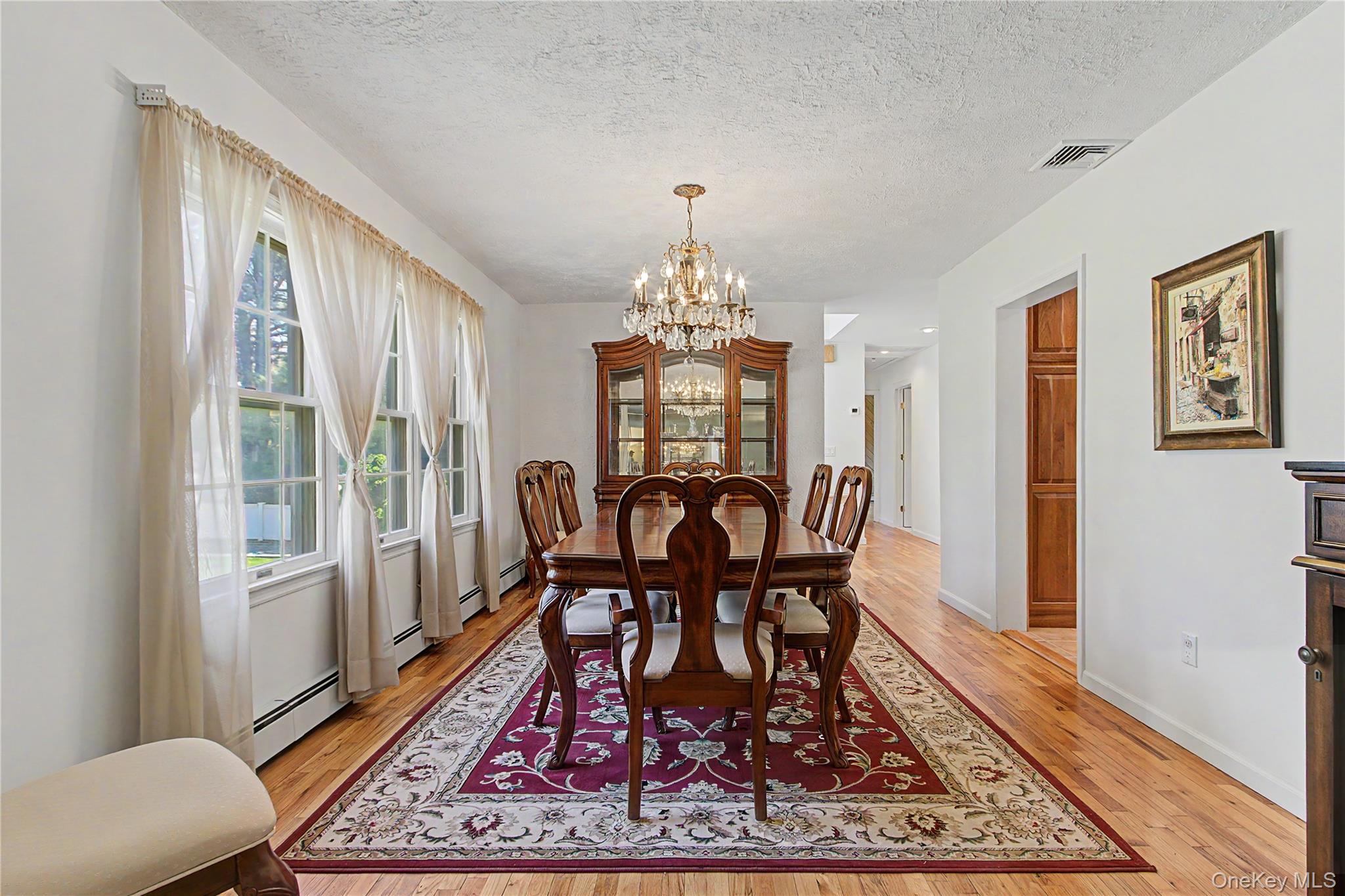 24 Richard Road Mahopac, NY 10541 - Photo 9 of 47 a view of a dining room with furniture window and wooden floor
