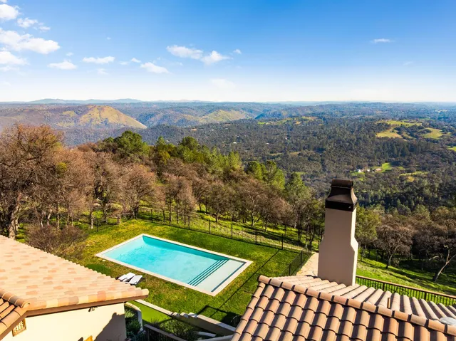a view of a house with a swimming pool
