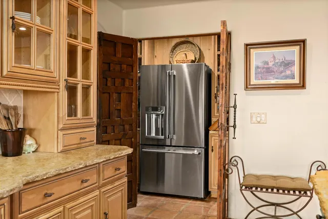 a view of a porch with a bench and a potted plant