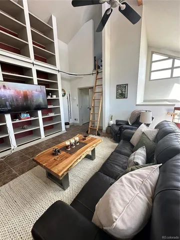 a view of a dining room with furniture and a window