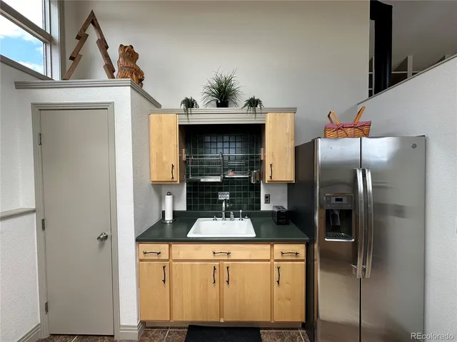 a view of a dining room with furniture large windows and wooden floor