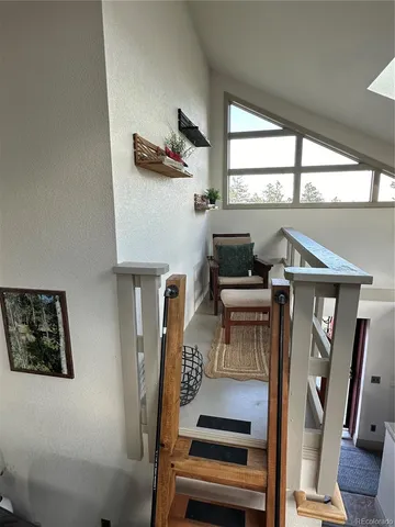 a bathroom with a toilet a sink and a window