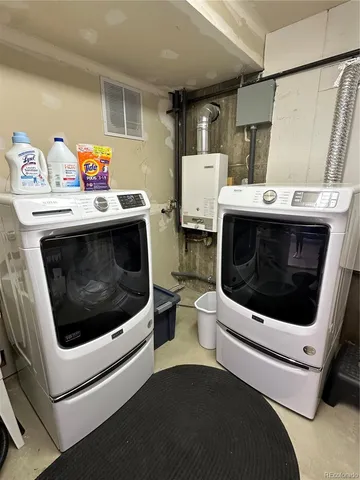 a view of a terrace with chairs and a fire pit