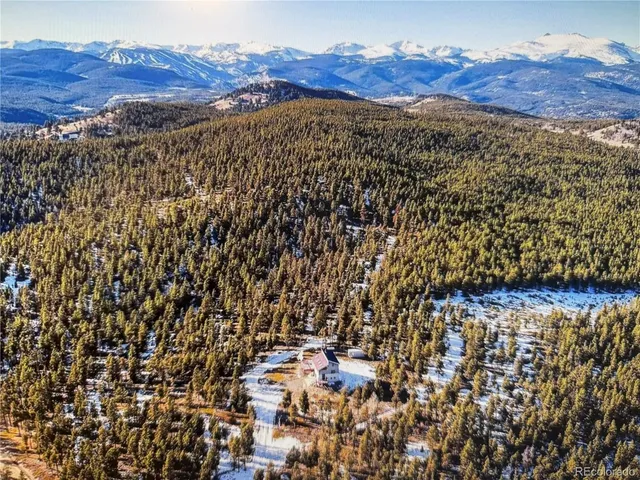 a view of a yard with table and chairs