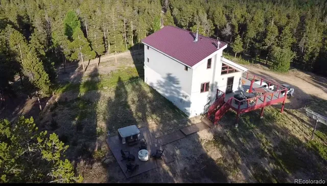 a aerial view of a house with a yard
