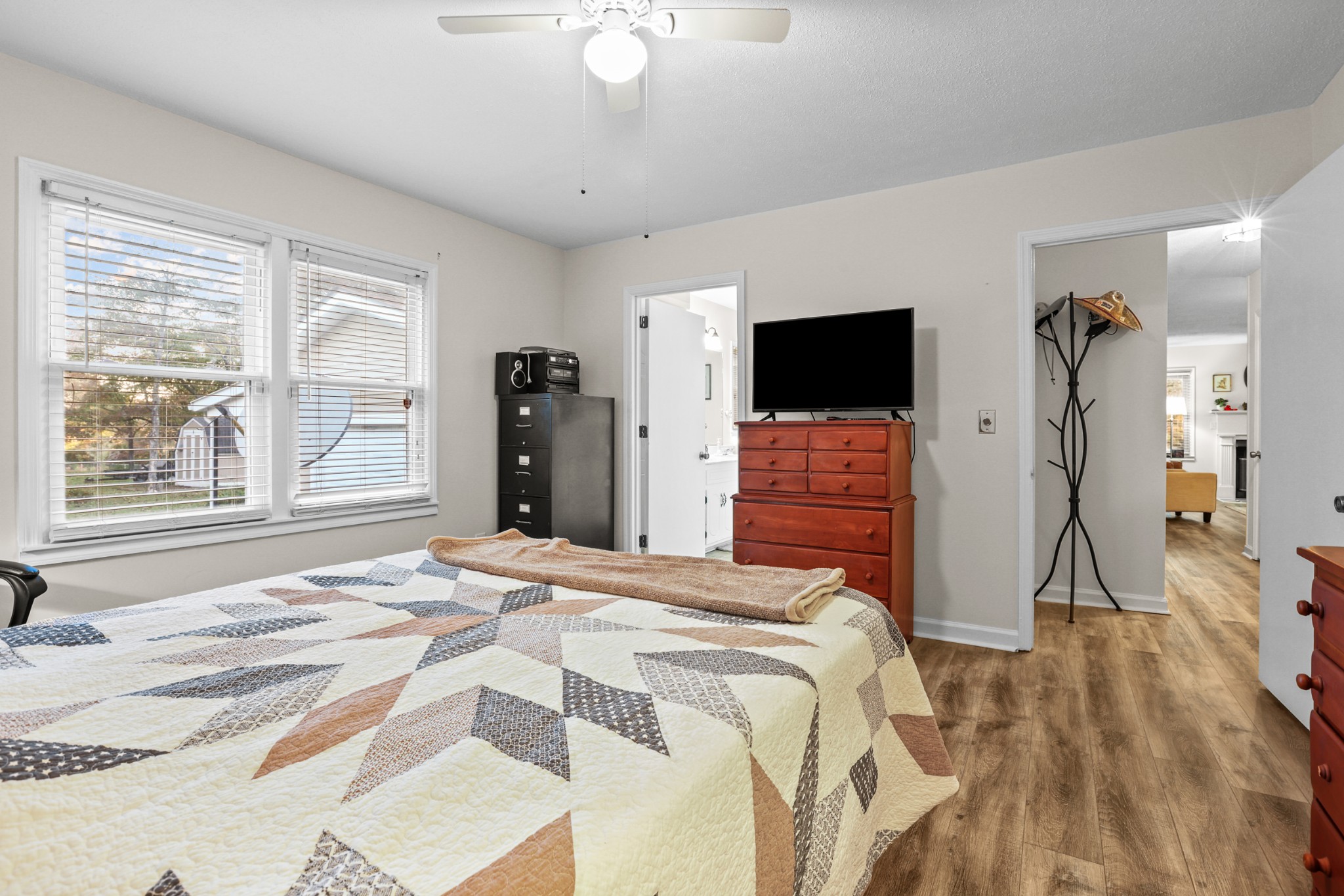 236 Old Columbia Road Dickson, TN 37055 - Photo 15 of 26 a bedroom with a bed and a flat tv screen on dresser