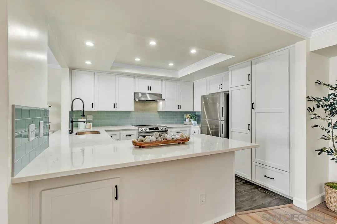 24 Montego Court Coronado, CA 92118 - Photo 12 of 71 a kitchen with refrigerator and cabinets