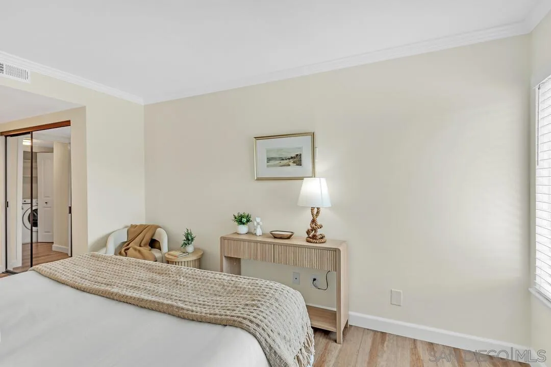 24 Montego Court Coronado, CA 92118 - Photo 26 of 71 a bedroom with a bed and wooden floor