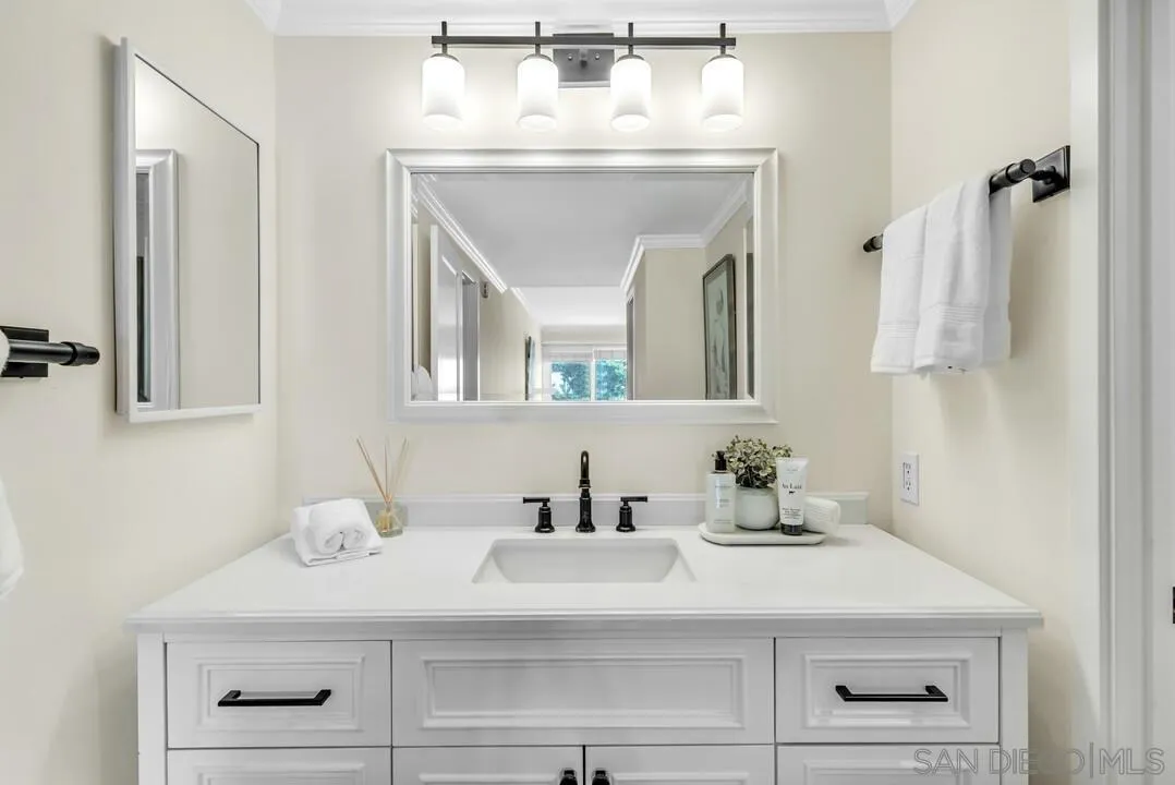 24 Montego Court Coronado, CA 92118 - Photo 34 of 71 a bathroom with a sink and a mirror