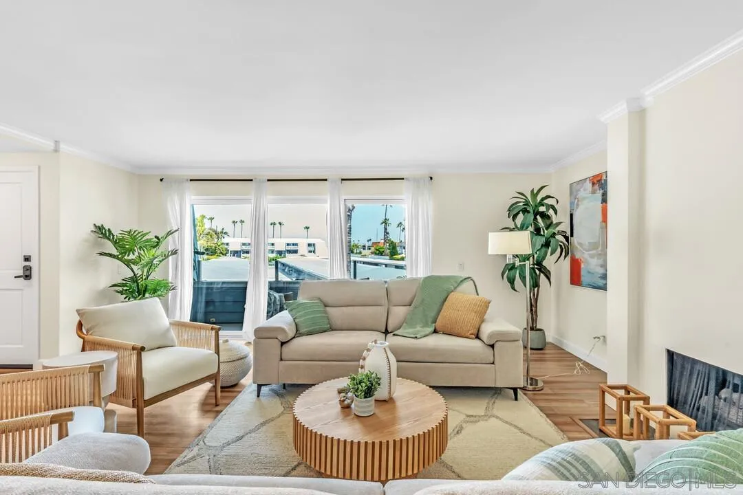 24 Montego Court Coronado, CA 92118 - Photo 4 of 71 a living room with furniture and a dining table with potted plants