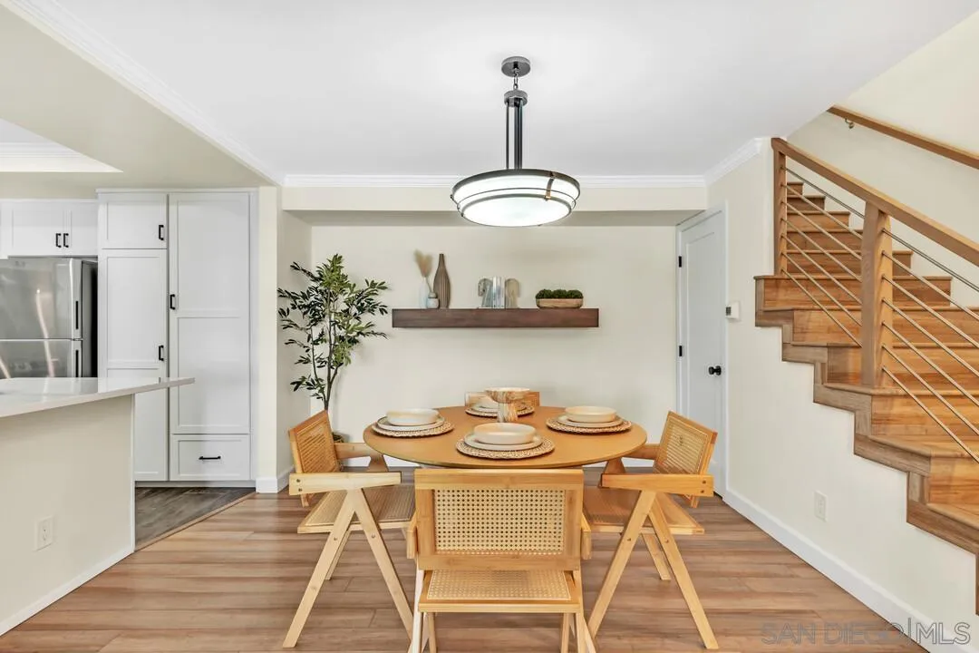 24 Montego Court Coronado, CA 92118 - Photo 7 of 71 a view of a dining room with furniture wooden floor and chandelier