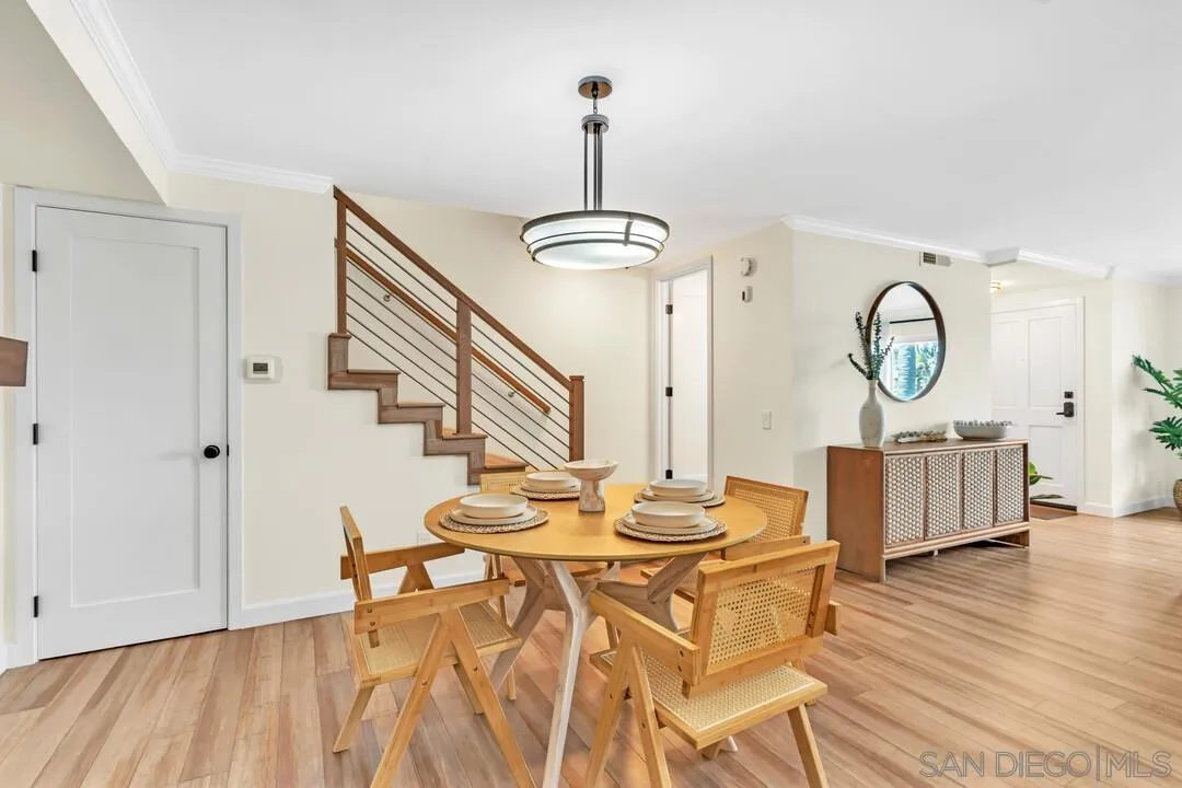 24 Montego Court Coronado, CA 92118 - Photo 9 of 71 a view of a dining room with furniture and wooden floor