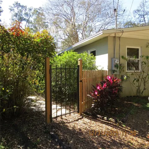 a view of a backyard with garden