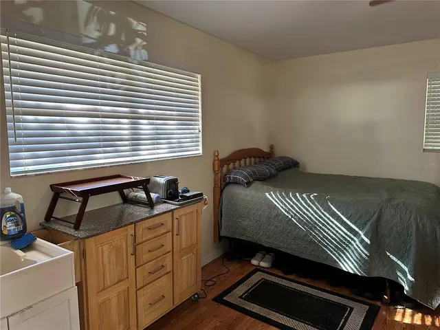 a bedroom with a bed and dresser