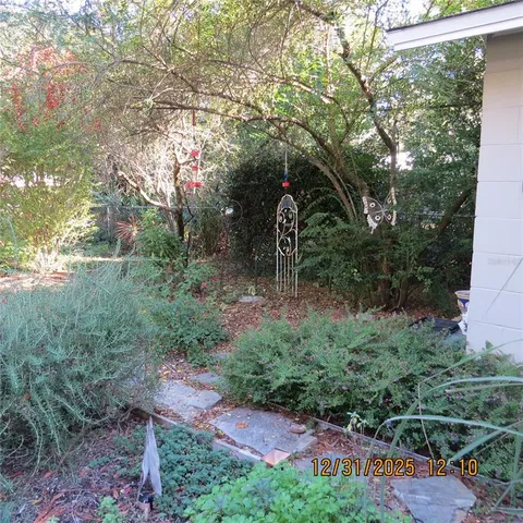 a backyard of a house with lots of green space