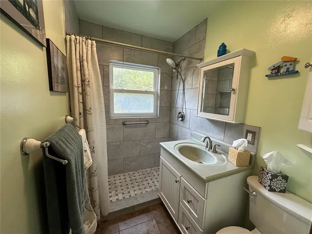 a bathroom with a sink a mirror and a bathtub