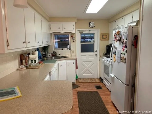 a bathroom with a granite countertop sink and a toilet