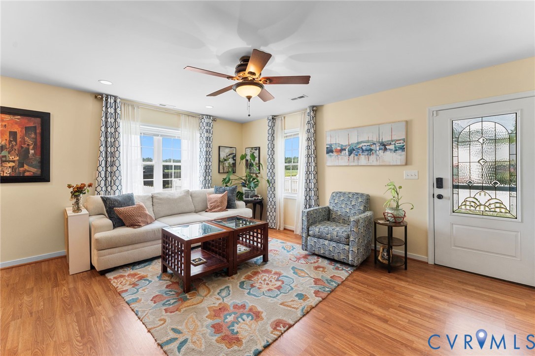 110 Hampton Road Dunnsville, VA 22454 - Photo 5 of 40 a living room with furniture and a window