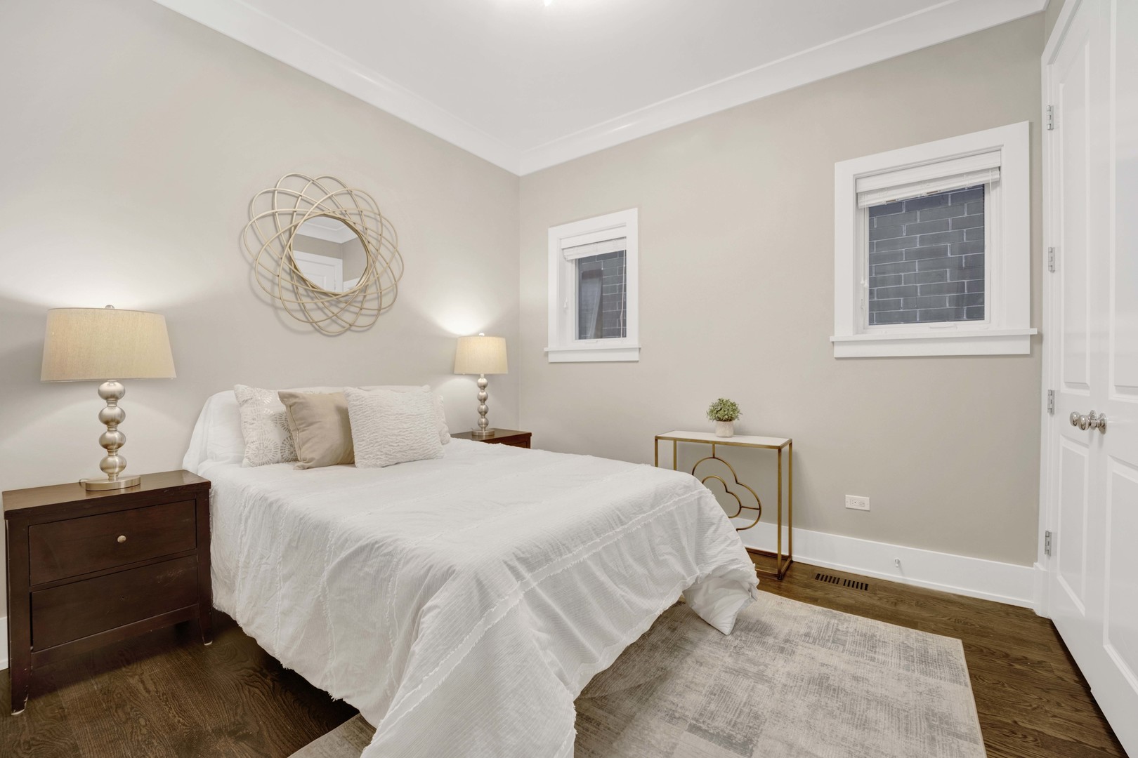 2652 North Racine Avenue, Unit 2 Chicago, IL 60614 - Photo 12 of 17 a bedroom with a bed and a lamp on dresser
