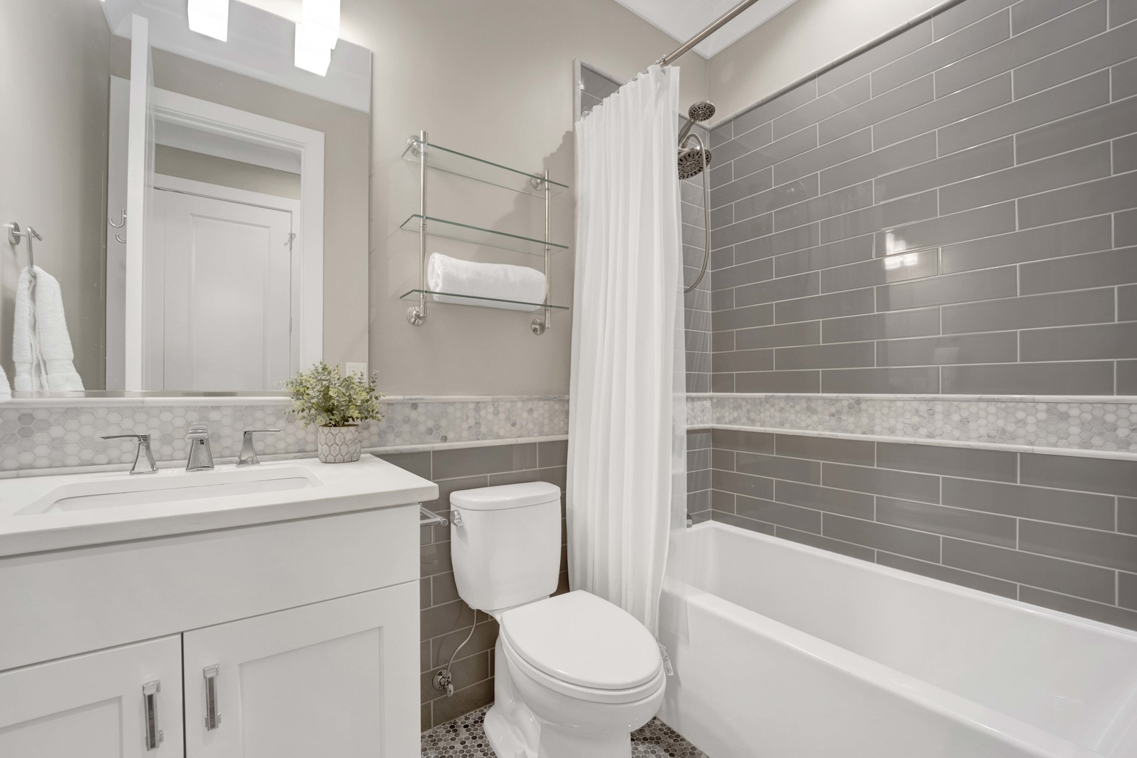 2652 North Racine Avenue, Unit 2 Chicago, IL 60614 - Photo 13 of 17 a bathroom with a sink a toilet and shower