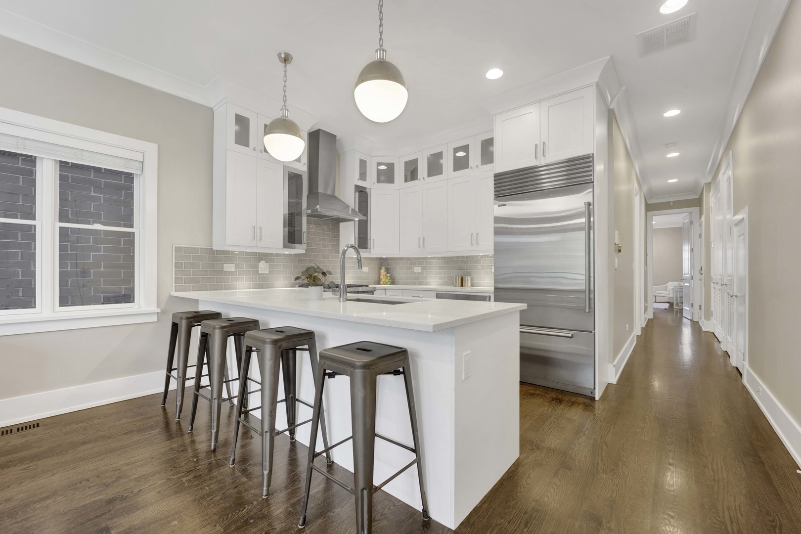 2652 North Racine Avenue, Unit 2 Chicago, IL 60614 - Photo 4 of 17 a kitchen with stainless steel appliances granite countertop a kitchen island a stove a cabinets and a sink