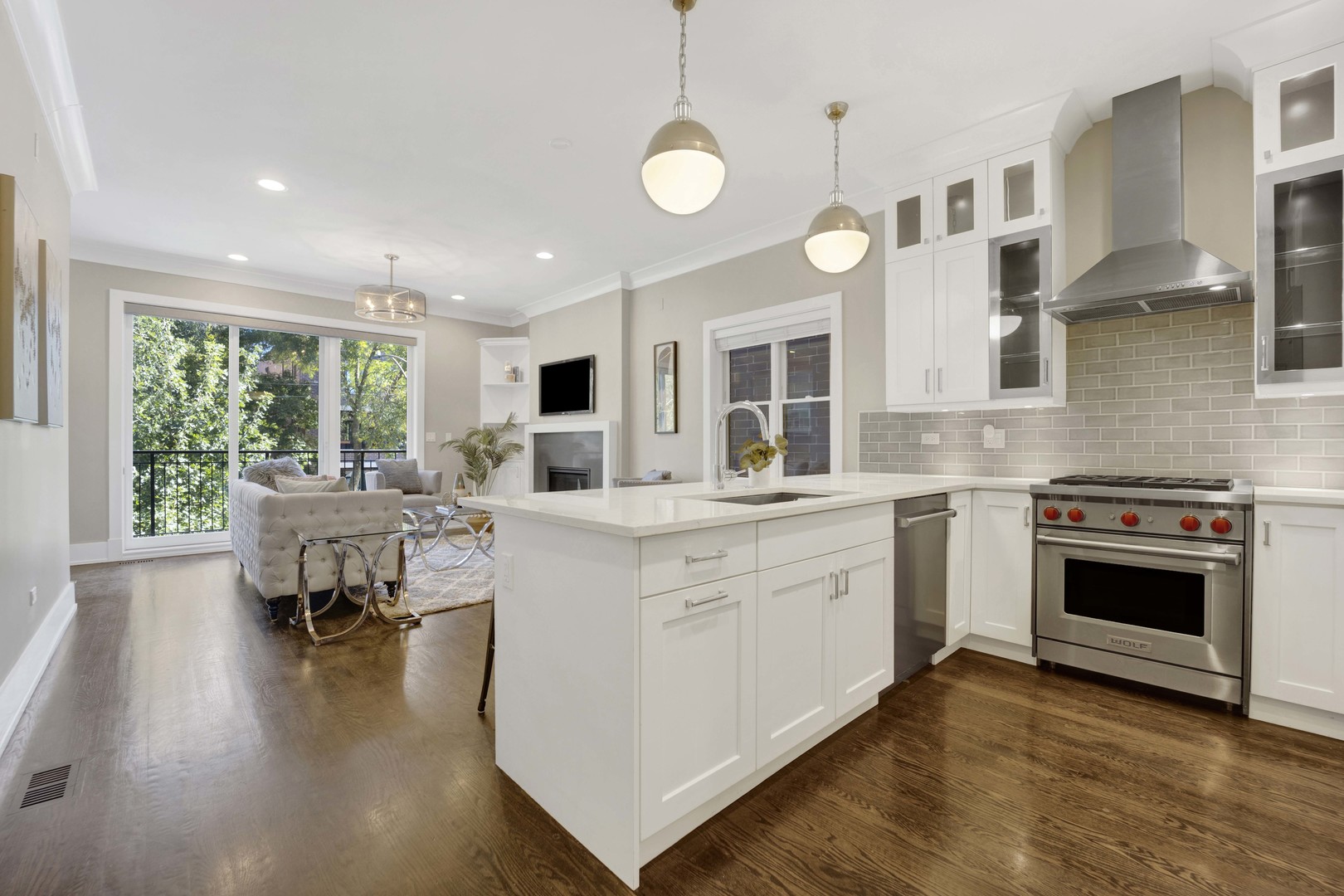 2652 North Racine Avenue, Unit 2 Chicago, IL 60614 - Photo 5 of 17 a kitchen with a stove and a wooden floor