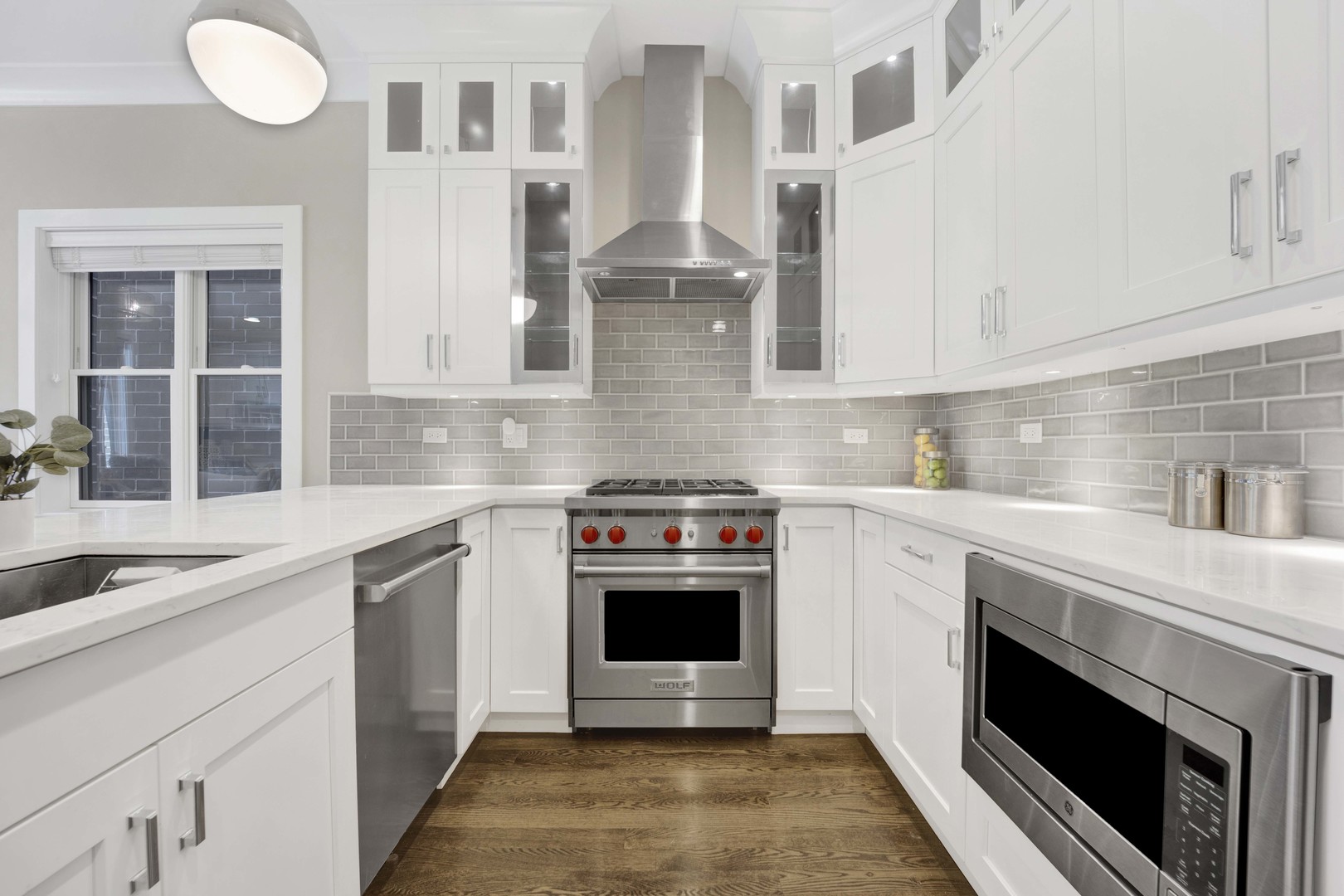 2652 North Racine Avenue, Unit 2 Chicago, IL 60614 - Photo 6 of 17 a kitchen with stainless steel appliances granite countertop a stove and a sink