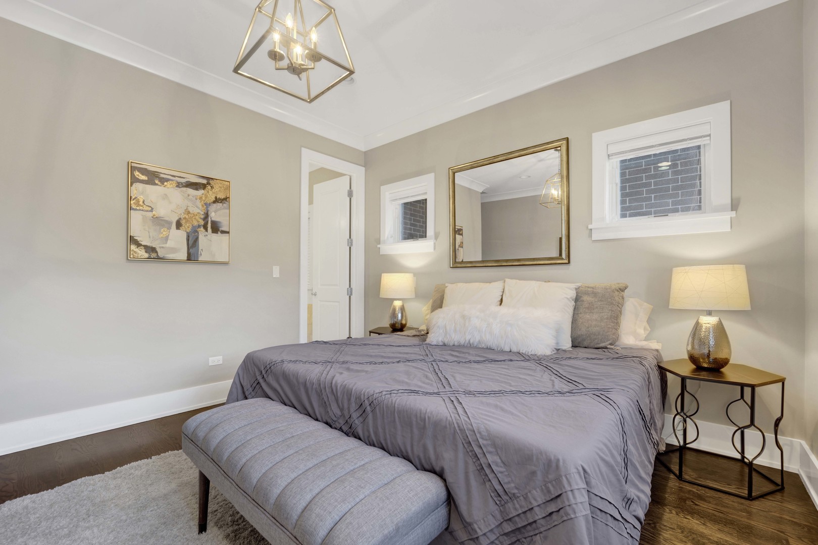 2652 North Racine Avenue, Unit 2 Chicago, IL 60614 - Photo 9 of 17 a bedroom with a bed and a lamp on table